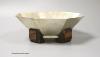 A German? Art Deco 800 standard white metal octagonal fruit bowl, on four stepped coromandel wood feet, indistinct maker's mark, diameter 22.2cm, gross weight 18oz.                                                        