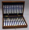 A set of twelve late Victorian plated engraved dessert knives and forks, with mother of pearl pistol handles, cased                    