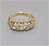 A Victorian 18ct gold and seven stone diamond half hoop ring, size O.                                                                  