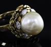 An 18ct gold, diamond and cultured pearl dress ring by John Donald, circa 1970, in modernist setting, size P/Q.                        