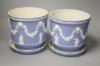 A pair of Victorian Wedgwood blue ground jasperware jardinieres and stands                                                                                                                                                  