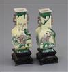 A pair of Chinese miniature enamelled biscuit (susancai) vases, 18th century, H. 8.3cm, wood stands, in a fitted hongmu case           