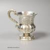 A mid 19th century Indian Colonial white metal vase shaped christening mug, by George Gordon & Co, Madras, (1821-1845) height 10.5cm, 5oz.                                                                                  