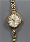 A lady's 9ct gold Accurist manual wind wrist watch.                                                                                    