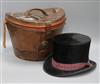 A Victorian top hat with leather case                                                                                                  