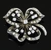 An 18ct white gold and diamond flower form quatrefoil brooch of openwork form, 33mm.                                                   