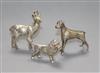 A silver model of a poodle and two other model animals.                                                                                