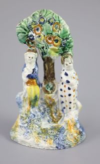 A Staffordshire Prattware 'Toy' group, c.1790-1800, 13.5cm high                                                                        