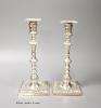 A matched pair of late Victorian/Edwardian silver candlesticks, Thomas Bradbury & Sons, London, 1893/4 & London, 1905, 26.2cm, weighted                                                                                     