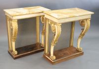 A pair of William IV parcel gilt cream painted and rosewood console tables, W.2ft 6in. D.1ft 6.5in. H.2ft 11.5in.                      