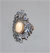 A 20th century continental? yellow and white metal mounted sapphire and cabochon coral upfinger dress ring, size N.                    