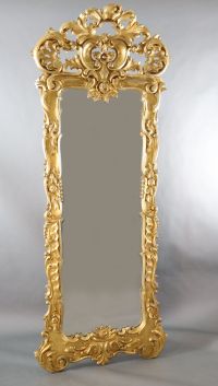 A late 19th century French carved giltwood wall mirror, W.3ft 3in. H.8ft 5in.                                                          