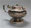 A George IV embossed silver pedestal mustard pot, Abstinando King, London, 1822.                                                       