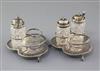 A pair of Victorian silver three division cruet stands by Edward Hutton, 13.8cm.                                                       