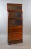 A Globe Wernicke mahogany sectional bookcase, W.86.5cm D.36cm H.216cm.                                                                                                                                                      