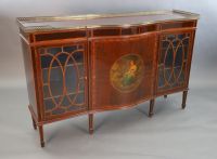 An Edwardian rosewood banded mahogany serpentine dwarf bookcase, W.5ft 1.5in. D.1ft 6in. H.3ft 3in.                                    