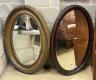 Two early 20th century oval simulated grain wall mirrors, larger width 68cm, height 96cm                                                                                                                                    
