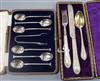 A cased set of six silver teaspoons and pair of tongs and a cased christening trio.                                                    