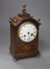 An inlaid mahogany mahogany mantel clock with brass ball finials, height 28cm                                                                                                                                               