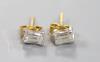 A pair of millennium cut diamond and gold stud earrings.                                                                                                                                                                    