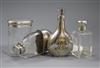 A silver perfume flask with monogram, two silver-mounted toilet bottles and a silver-mounted glass hip flask                           