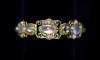 An early 20th century Arts & Crafts gold, cabochon moonstone and split pearl set bracelet                                                                                                                                   