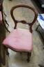 A set of four Victorian rosewood balloon back dining chairs                                                                                                                                                                 