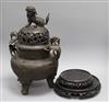 A large Chinese bronze tripod censer and cover and two wood stands censer height 42cm                                                  