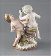 A Meissen group of two putti emblematic of Europe and America, height 24.3cm, losses                                                   