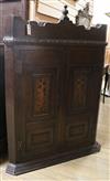 A George III inlaid oak corner cupboard W.105cm                                                                                        