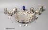 A modern pierced silver shallow dish, S.J. Rose & Son, Sheffield, 1964, 20.3cm and a late Victorian silver six piece condiment set, with two spoons, Birmingham, 1897, one liner missing and one extra liner                