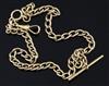 An 18ct. gold oval link albert, 38cm.                                                                                                  