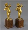 A pair of 17th century Italian gilt metal figures of putto playing mandolins, overall height 7.75in.                                   