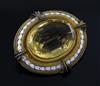 A Victorian gold, white enamel and citrine set oval brooch, 50mm.                                                                      