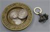 A brass tray, various coins and a rattle dish 11.5cm diameter                                                                          