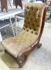 A Victorian mahogany slipper chair.                                                                                                                                                                                         