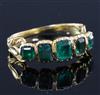 An early Victorian gold and foil backed? emerald five stone half hoop ring, size L.                                                    