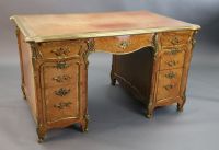 An early 20th century Louis XVI style ormolu mounted satinwood and rosewood kneehole desk, W.4ft 5in. D.2ft 8in. H.2ft 6in.            