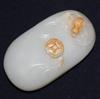 A Chinese white and russet jade pebble                                                                                                 