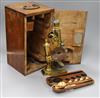 A mahogany cased brass microscope and a Negretti & Zambra hygrometer                                                                   