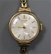 A lady's 9ct gold Longines manual wind wrist watch, on a 9ct gold bracelet (af).                                                       