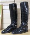 A pair of black leather riding boots and trees                                                                                         