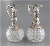 A good pair of Victorian silver mounted cut glass claret jugs by Horace Woodward & Co, 30cm.                                           