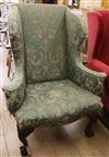 An upholstered wing armchair                                                                                                           