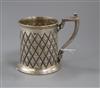 A Victorian embossed silver christening mug, Atkin Brothers, Sheffield, 1865, 92mm.                                                    