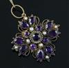 A Victorian gold, amethyst and split pearl set quatrefoil pendant, pendant 42mm.                                                       