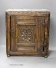 A small 17th century carved oak wall cabinet, enclosed by single panelled door with iron butterfly hinges, width 37cm                                                                                                       