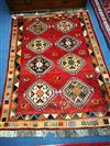 A Quashgai brick red ground geometric rug 175 x125 cm                                                                                  