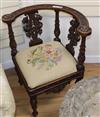 An early 20th century carved walnut corner chair                                                                                       