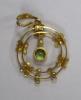 An early 20th century 9ct, peridot and seed pearl set drop pendant, overall 35mm, gross weight 2.1 grams.                                                                                                                   